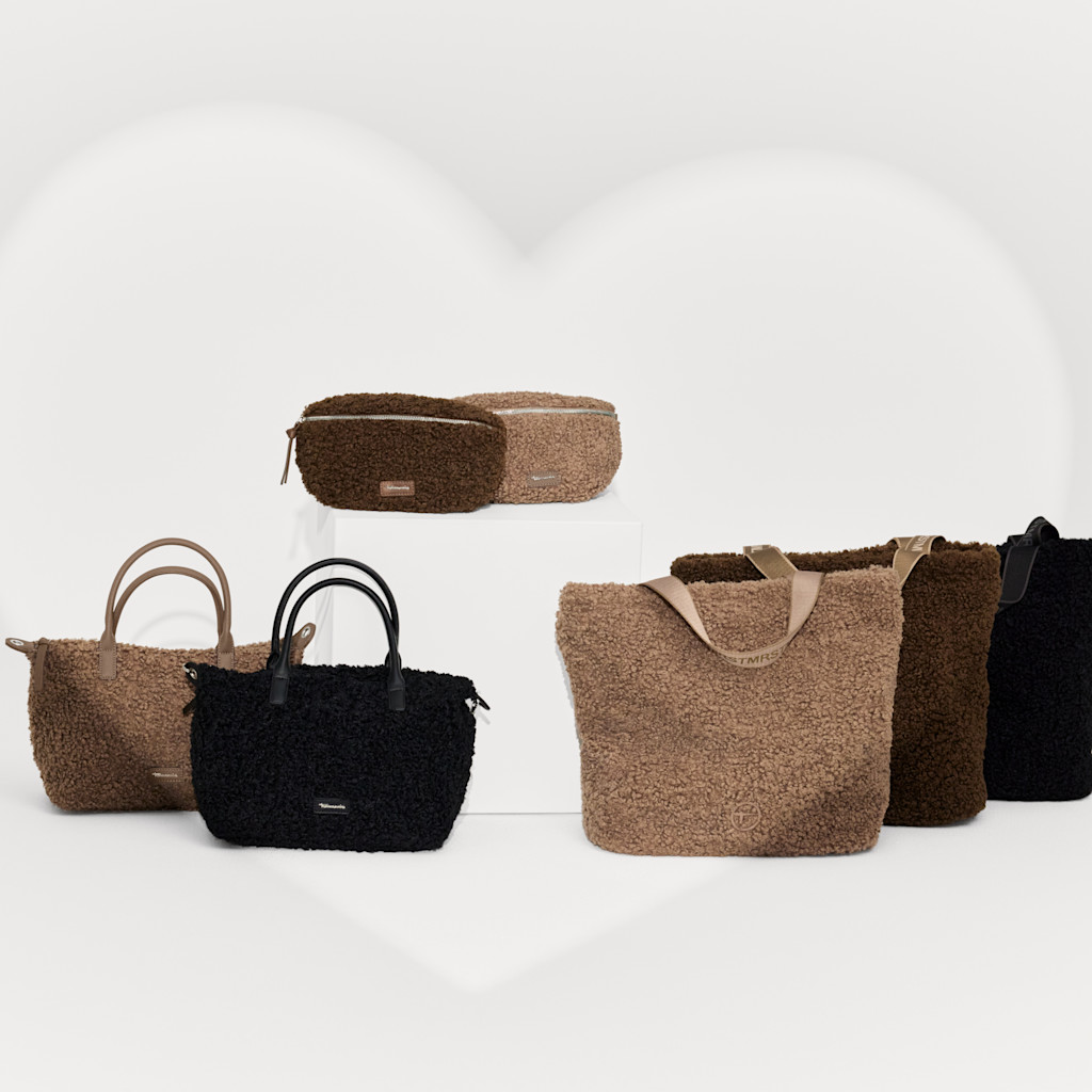 Collection of fluffy teddy bags in beige, brown and black, including shoppers, handbags and a belt bag.