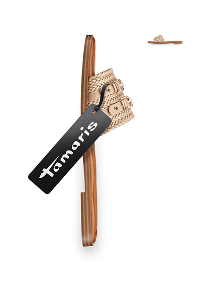 Beige Tamaris mule with braided strap and brown sole against a white background.