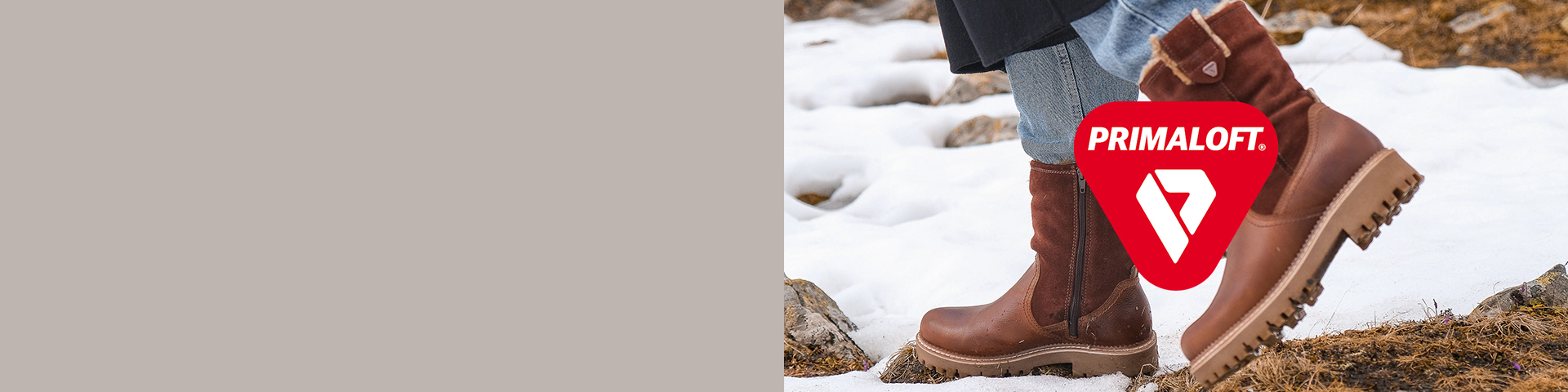 Brown Primaloft winter boots in the snow, with red brand logo on a snowy background
