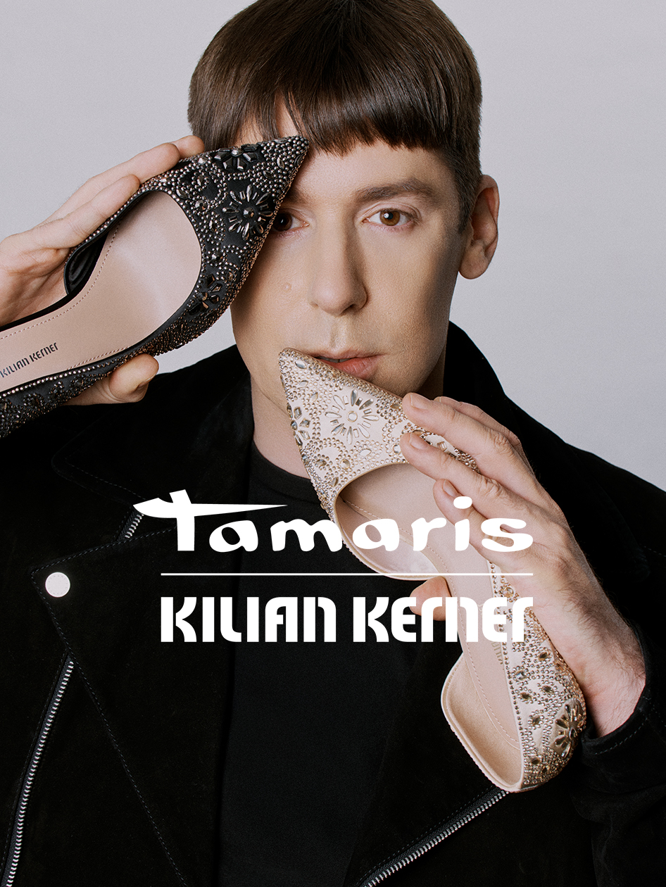 Glitter pumps in beige and black, held in front of the face of designer Killian Kerner.