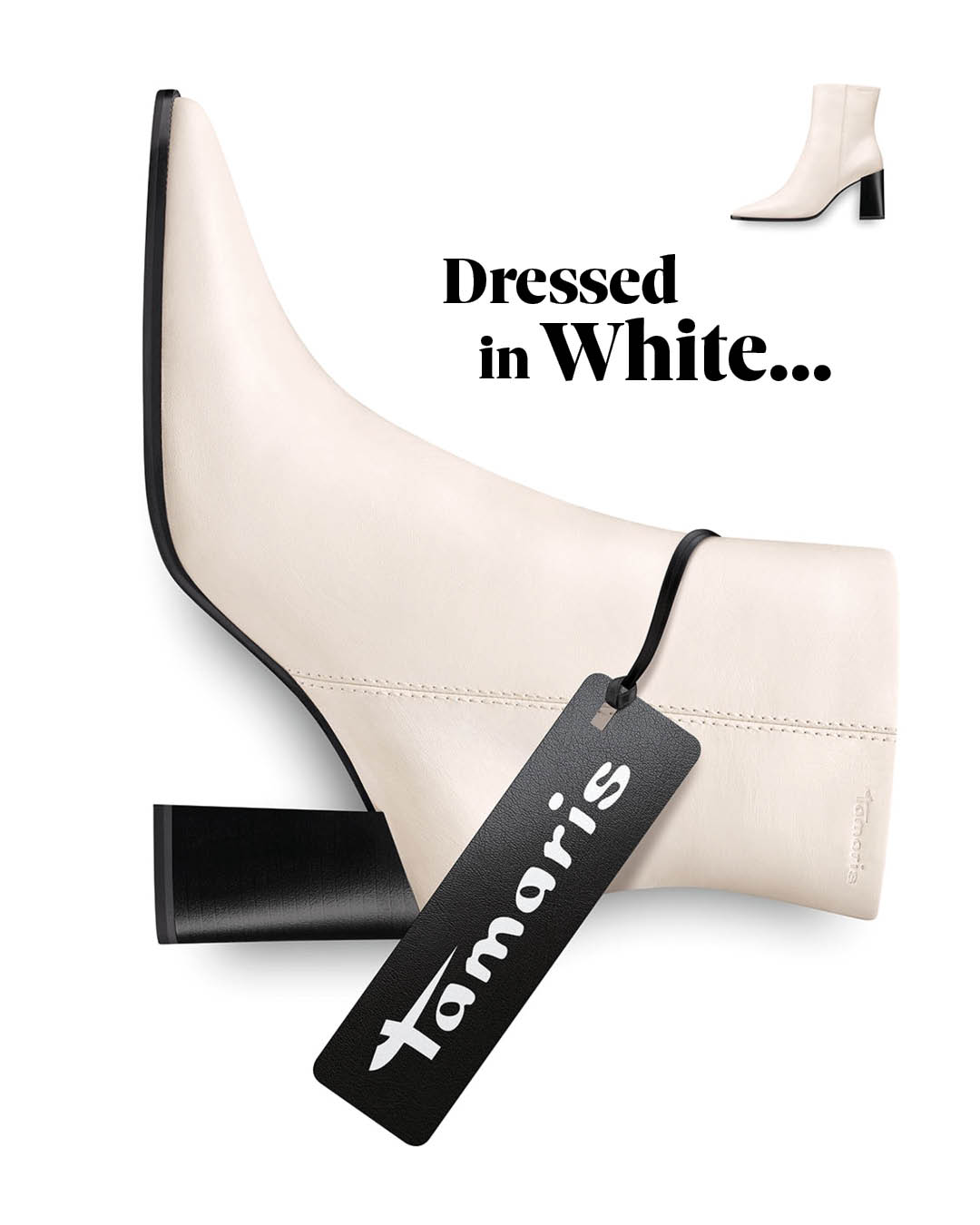 White Tamaris ankle boot with a black heel and label, featuring the inscription &ldquo;Dressed in White‖