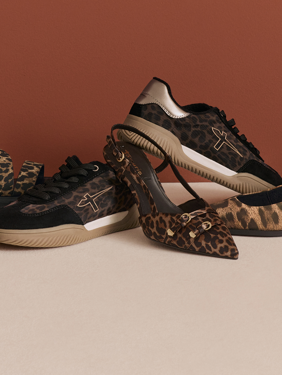 Zwei Paar Tamaris-Schuhe im Leopardenmuster: Sneaker mit Golddetails und ein spitzer Slingback-Pumps mit Goldschnallen.