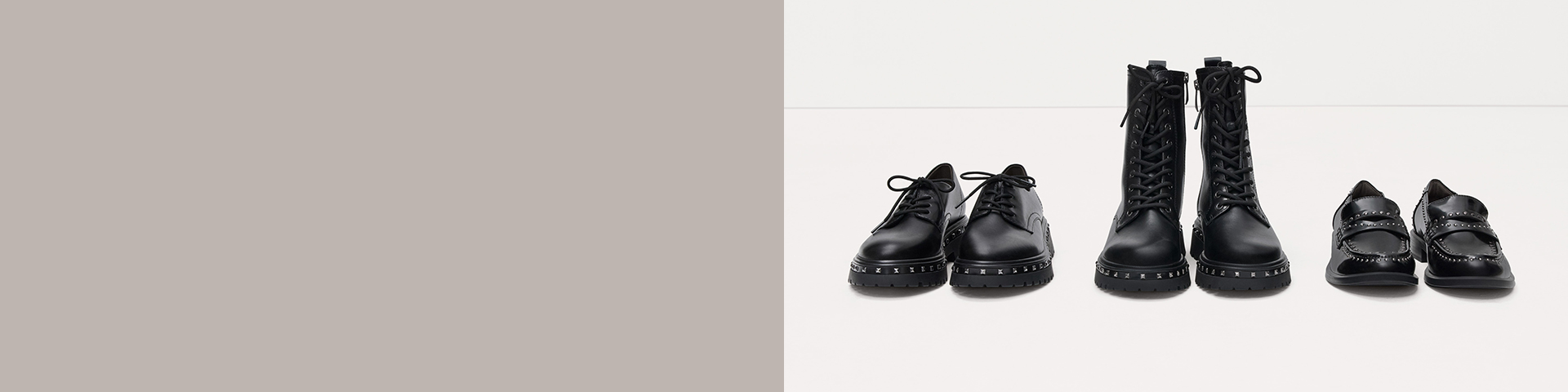 Various black leather shoe variants with studded details lined up in a row against a white background.