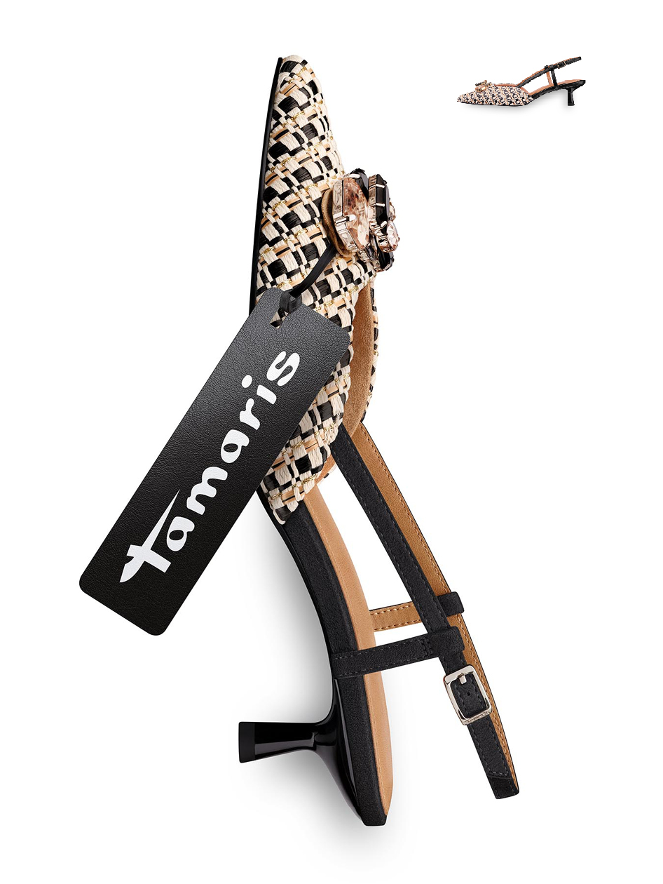 Elegant women&rsquo;s sandal in black with a braided strap and crystal embellishment, brand tag visible.