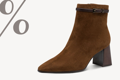 Brown ankle boot with a block heel, with a percent sign in the background.