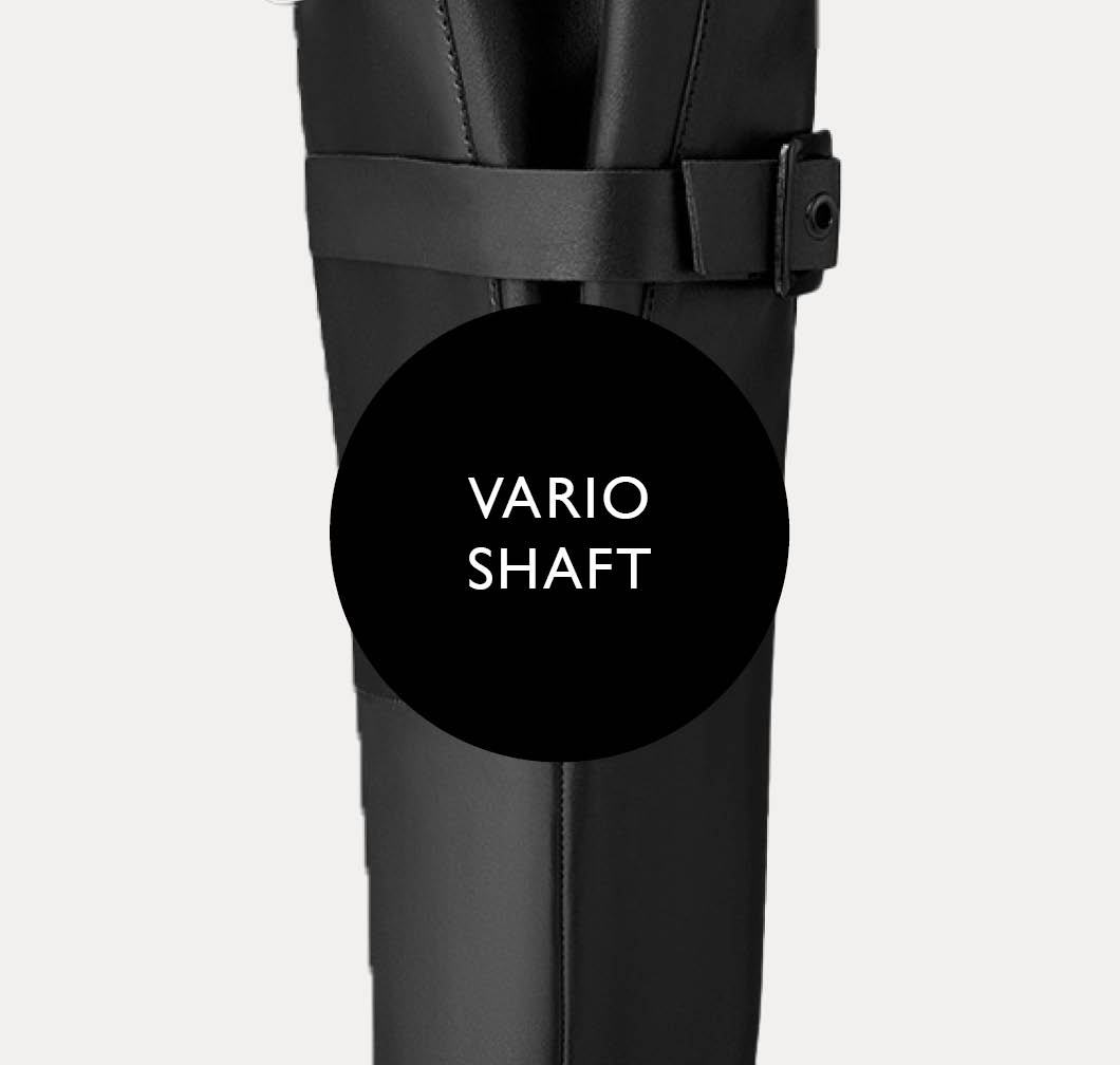 Black leather riding boot with an adjustable buckle fastening on the shaft, close-up showing the "Vario Shaft" label.