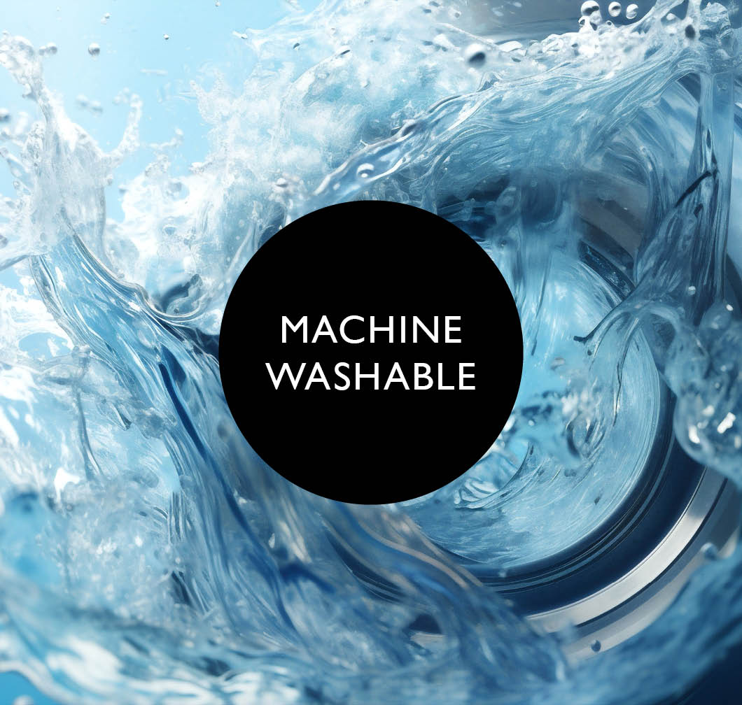 Close‑up of a washing machine drum with swirling water in blue tones. Black circle with the text &ldquo;Machine Washable&rdquo;.