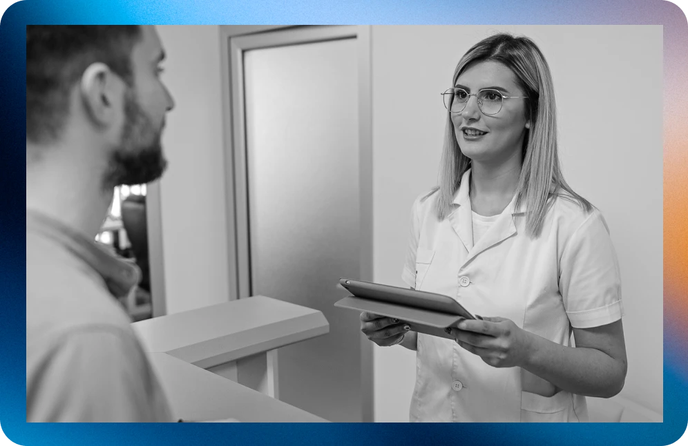 woman checking in patient with ipad