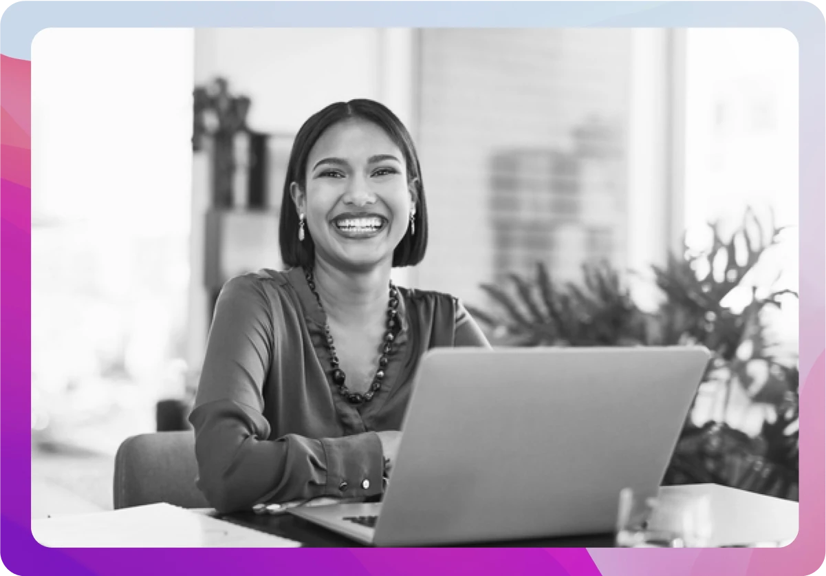 woman smiling working on computer