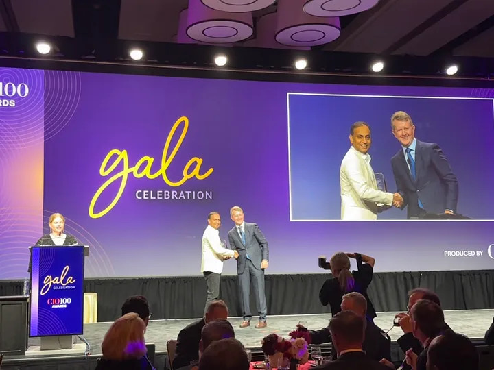 photo: Ally's Chief Information, Data and Digital Officer, Sathish Muthukrishnan, accepts an award for being recognized among the innovative companies of the CIO 100 from on the gala stage during the annual event.