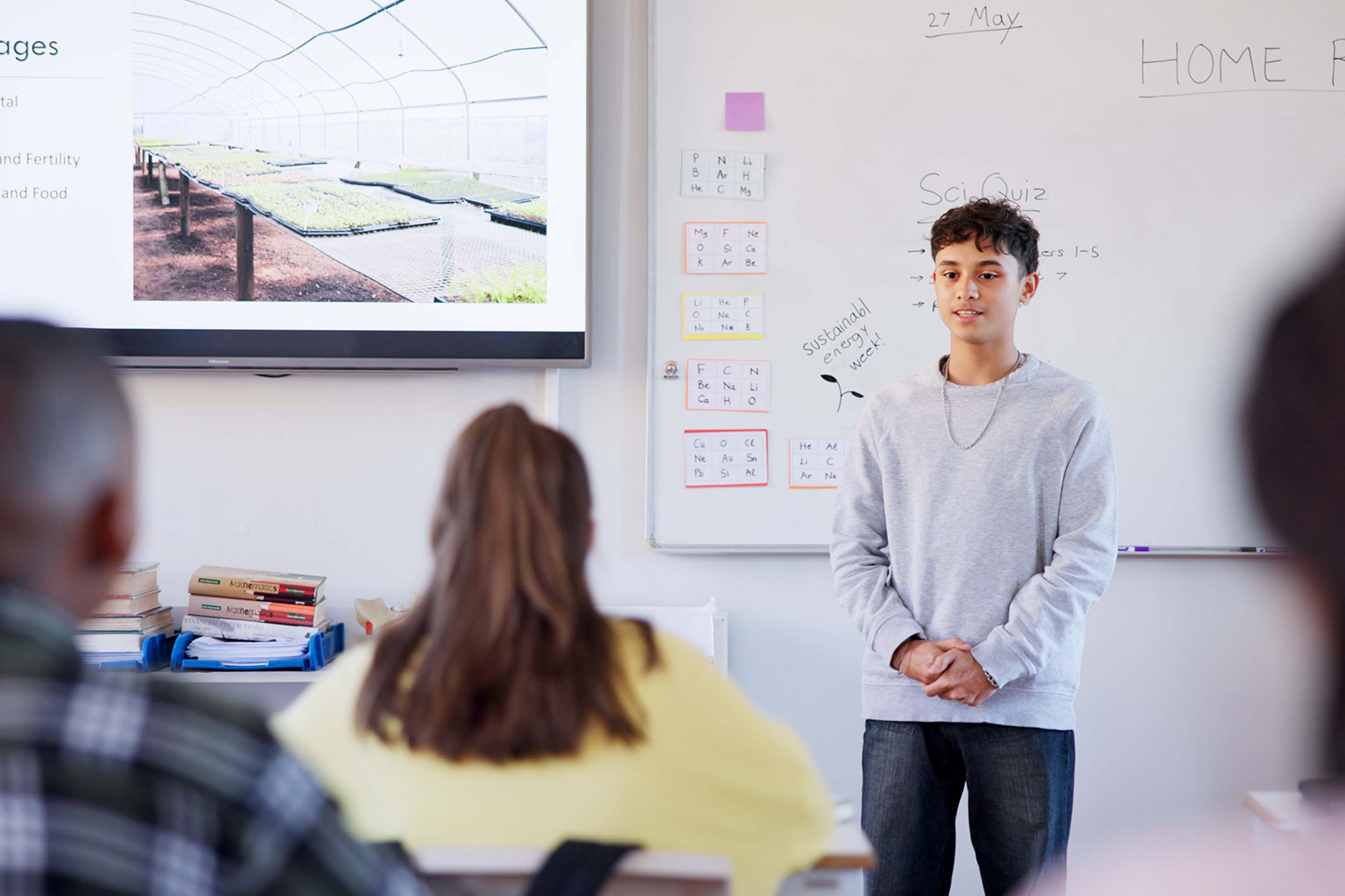 A student is building confidence by speaking in front of their class.