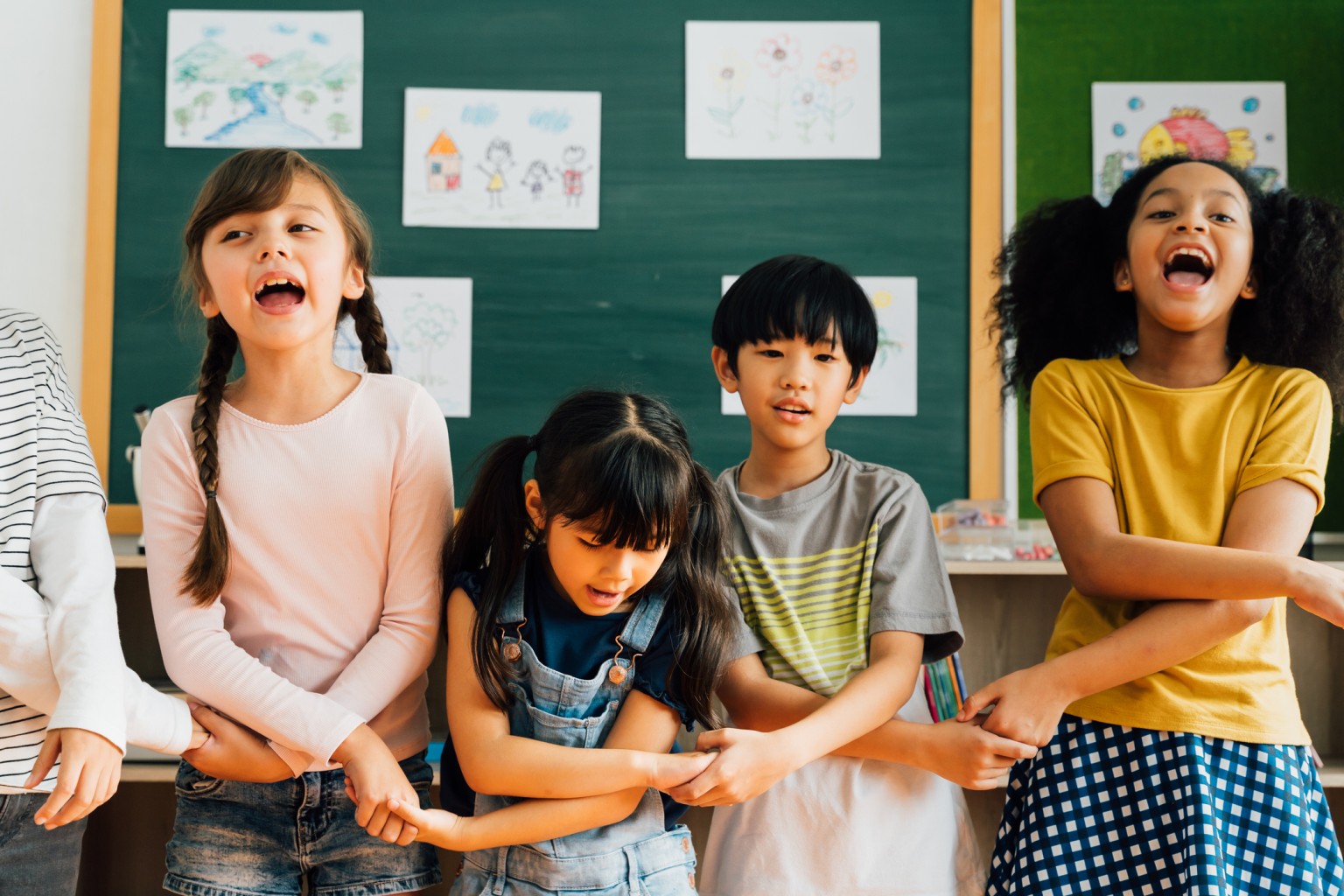 Kids taking a movement break in a classroom. 