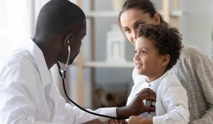 Image of a doctor conductiin a checkup on his patient relating to the healthcare industry 