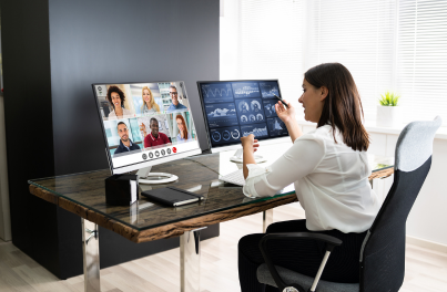woman speaking to people on a desktop