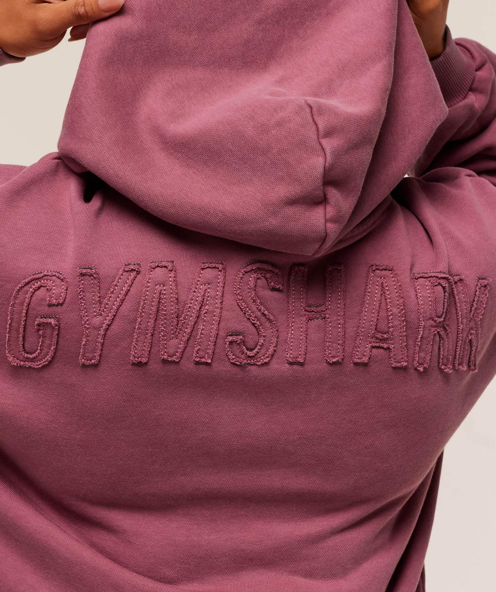 Raised Gymshark graphic to the shoulders