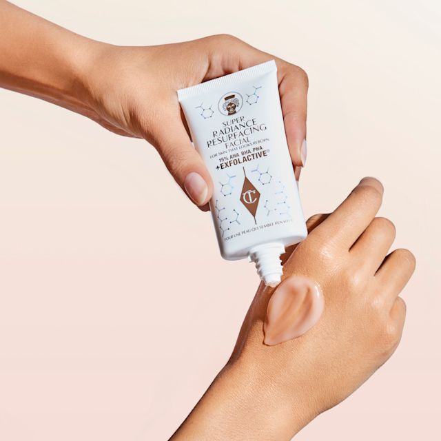 Model applying Super Radiance Resurfacing Facial to the hand