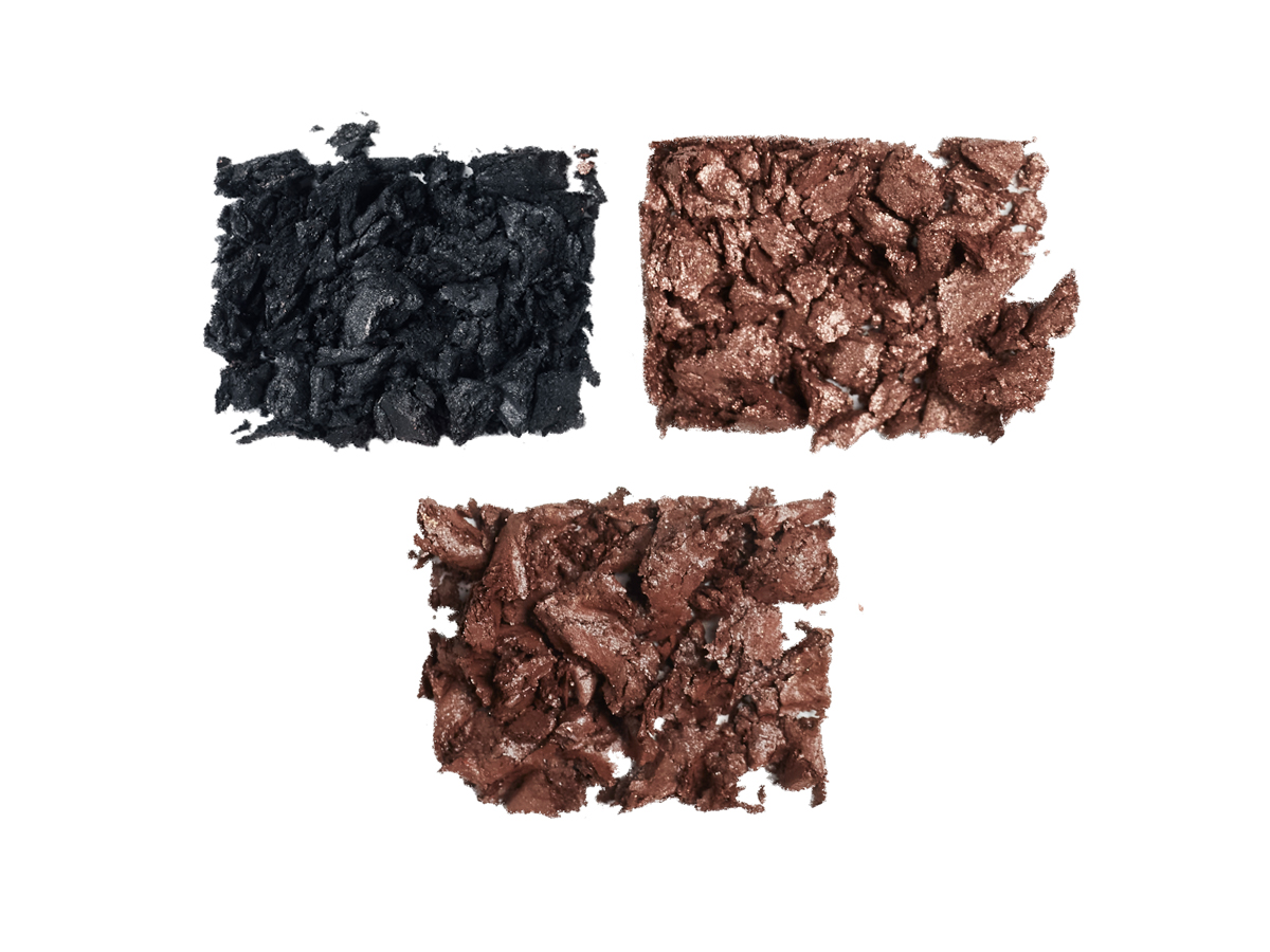 Swatches of three eyeshadows in grey-black, coffee brown, and bronze-brown,