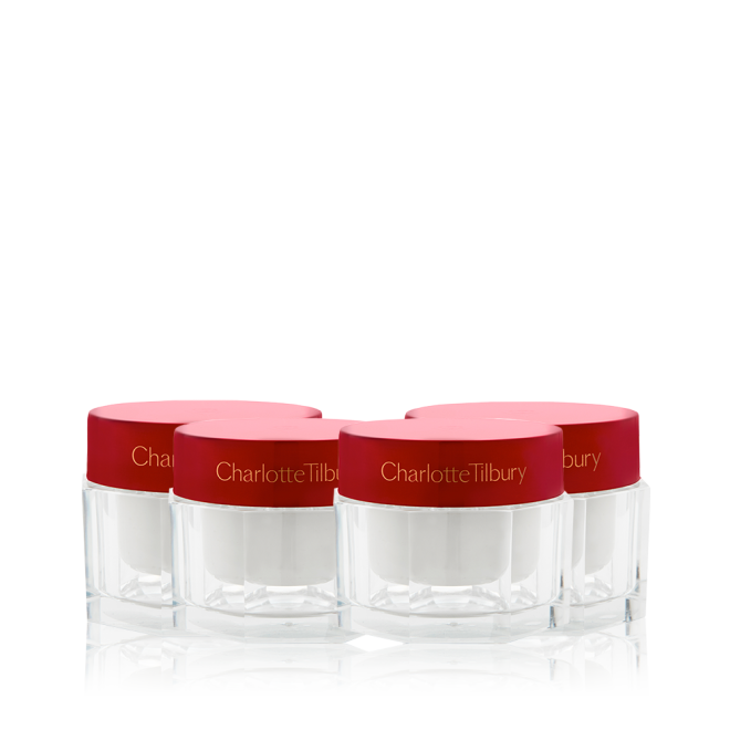 A collection of pearly-white face creams in glass jars with eye-catching, red-coloured lids. 