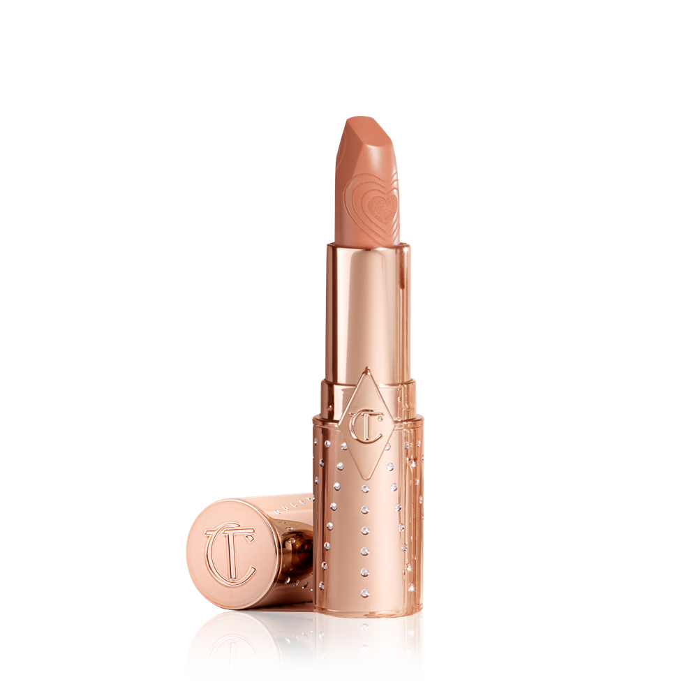 A warm caramel-nude lipstick with a satin finish in a gold-coloured tube.