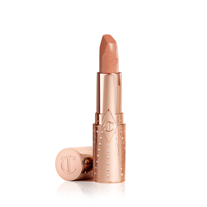 A warm caramel-nude lipstick with a satin finish in a gold-coloured tube.