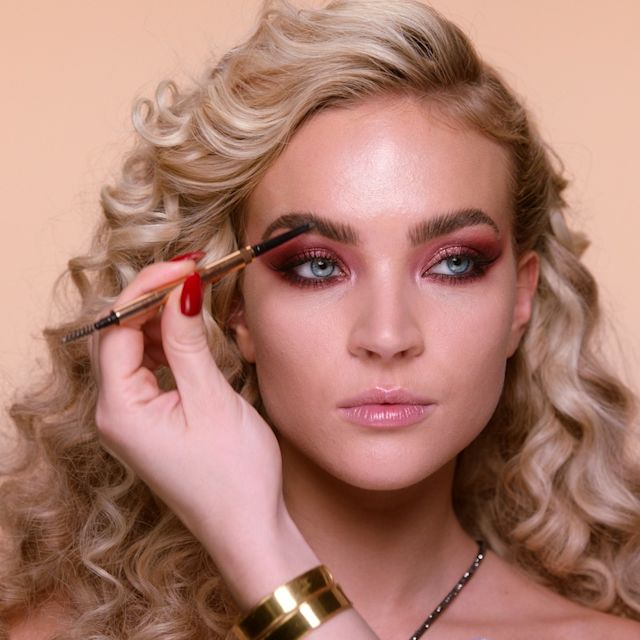Step 9 in Sofia Tilbury's 80s Makeup Look tutorial: create a bold eyebrow look