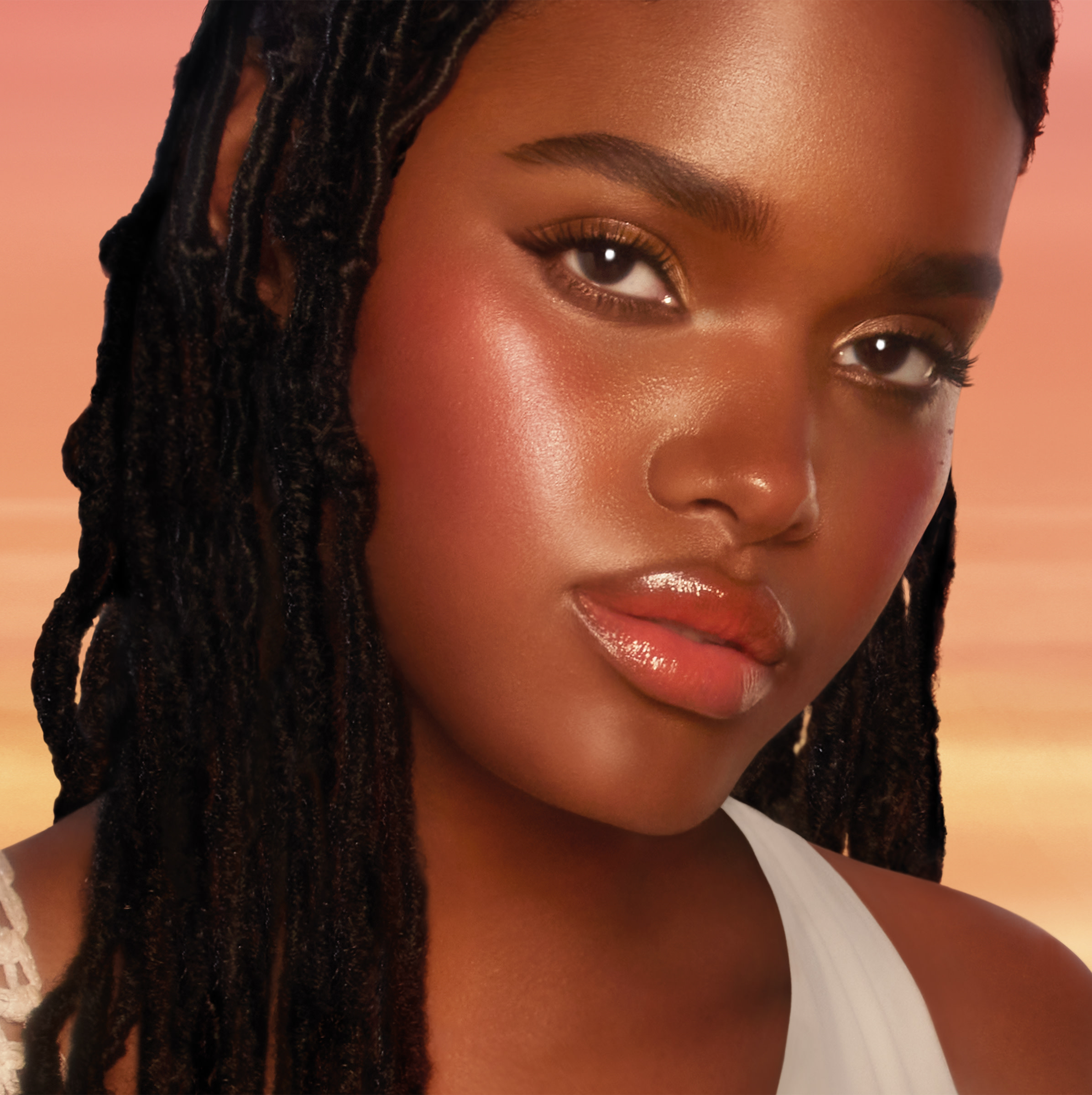 Aaliyah wearing a summer glow makeup look