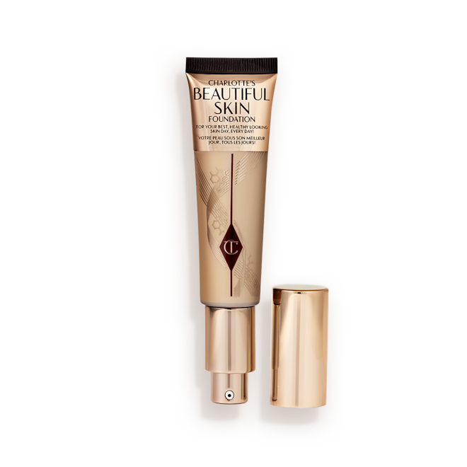 Beautiful Skin Foundation in Shade 4W open An open foundation tube in sleek, gold-coloured packaging with a gold-coloured lid with a gold-coloured pump dispenser.