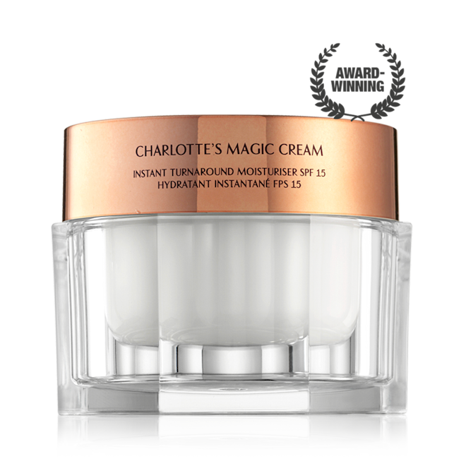 Charlotte's Magic Cream closed Pearly-white face cream in a glass jar with a gold-coloured lid with text on it, 'Charlotte's magic cream'.