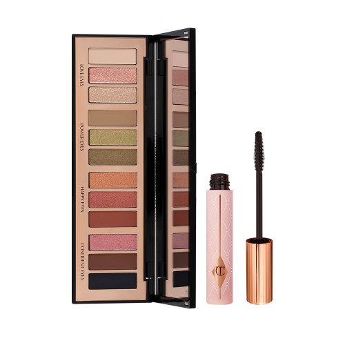 Black mascara in a sheer pink tube with a gold coloured lid and fluffy applicator and an open, 12-pan eyeshadow palette with a mirrored-lid with pink, gold, green orange, red, brown, black, and beige shades to create different smokey eye looks.
