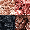 Swatches of matte and shimmery eyeshadows in rose gold, chocolate brown, champagne, and black.