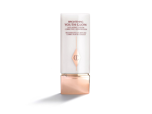 A colour-correcting face primer in a rectangular bottle with a square lid, in white and rose gold coloured packaging. 