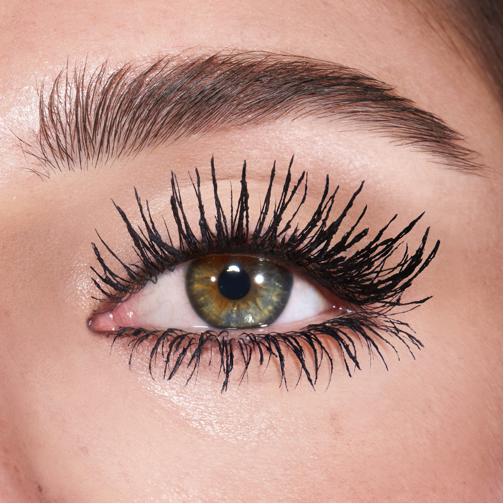 Model close up wearing Exagger-Eyes Mascara for a lengthening effect