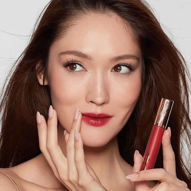 Aimee wearing a trending red lip lipstick look using Ruby Blur