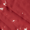 Close-up swatch of a moisturising lipstick balm in a cherry-red shade.