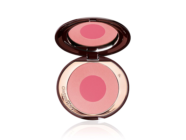 AN open, mirrored-lid two-tone blush in warm pink and magenta. 