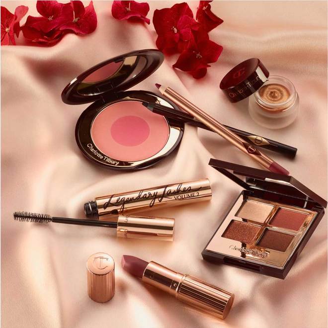 A mirrored-lid quad eyeshadow palette with shimmery and matte brown and gold shades, eyebrow tint, black eyeliner pen, mascara, two-tone blush in bright pink, eyeliner pencil in black, nude pink lip liner pencil, muted wine-coloured lipstick, and champagne-coloured cream eyeshadow.