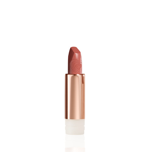 A  lipstick refill with its lid removed in a nude peach shade in a gold-coloured tube.