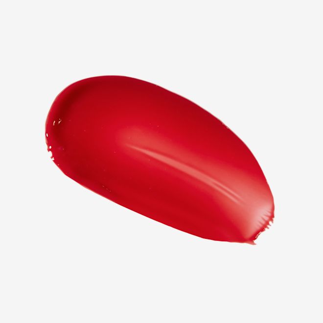 Tinted Love in Love Chain swatch Swatch of a creamy lip and cheek tint in a vibrant red shade.