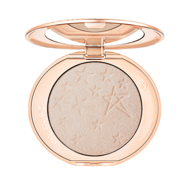 An open highlighter powder compact with a mirrored lid, in a shimmery silvery-opal shade. 