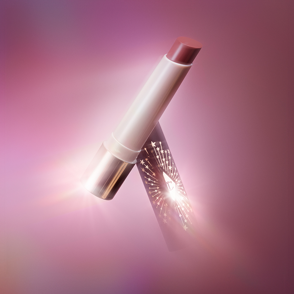 Hyaluronic Happikiss Pillow Talk lipstick balm with Pillow Talk backdrop