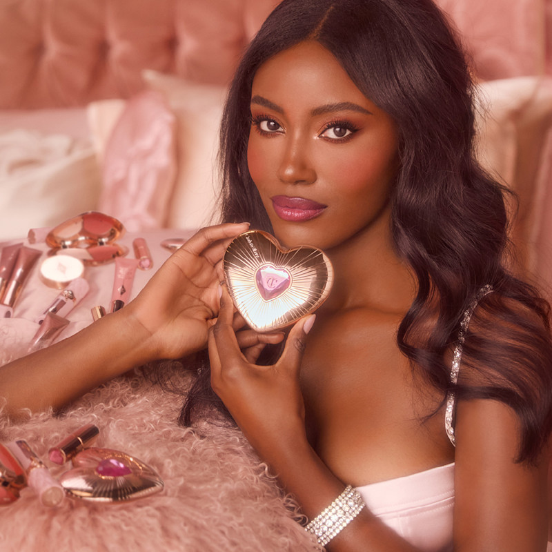 Ruffaro wearing Pillow Talk Beauty Soulmates Face Palette with pink setting powder