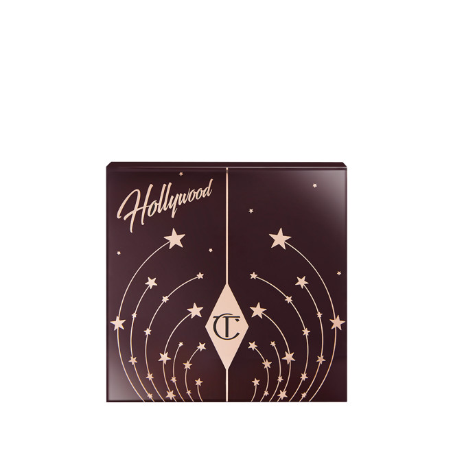 Closed eyeshadow palette with a dark brown-coloured palette with gold-coloured stars all over and Hollywood written on top. 
