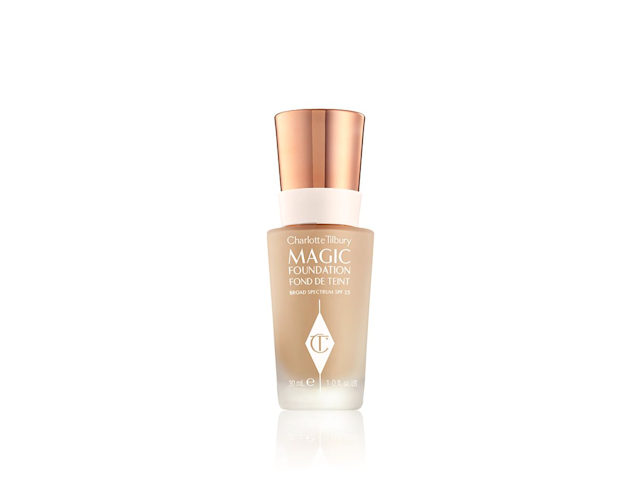 Foundation in a frosted, glass bottle with a metallic lid, in rose-gold, white, and clear packaging. 