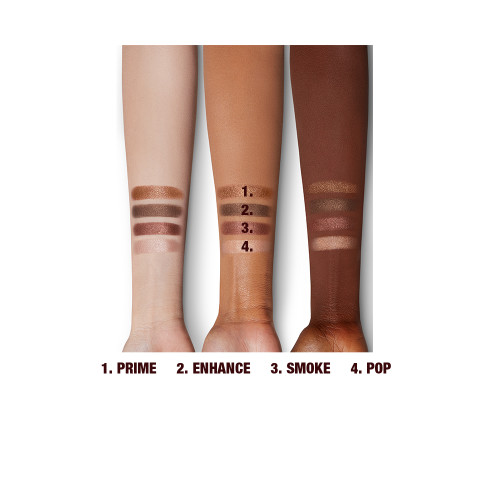 Arm swatches of four sparkly eyeshadows in bronze and copper shades on fair, tan, and deep skin. 
