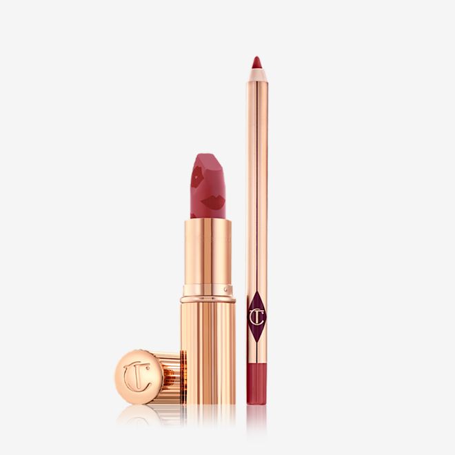 Luscious Lip Slick in First Dance open An open matte lipstick in a nude red shade with an open lip liner pencil in a muted red shade.