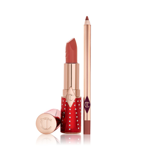 An open lipstick in red and gold packaging in a dark brown-peach shade with an open lip liner pencil in a matching colour.