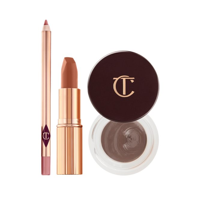 An open lip liner pencil in nude pink, open matte lipstick in nude pink in a gold-coloured tube, and an open pot of cream eyeshadow in a smokey taupe shade with its lid next to it.