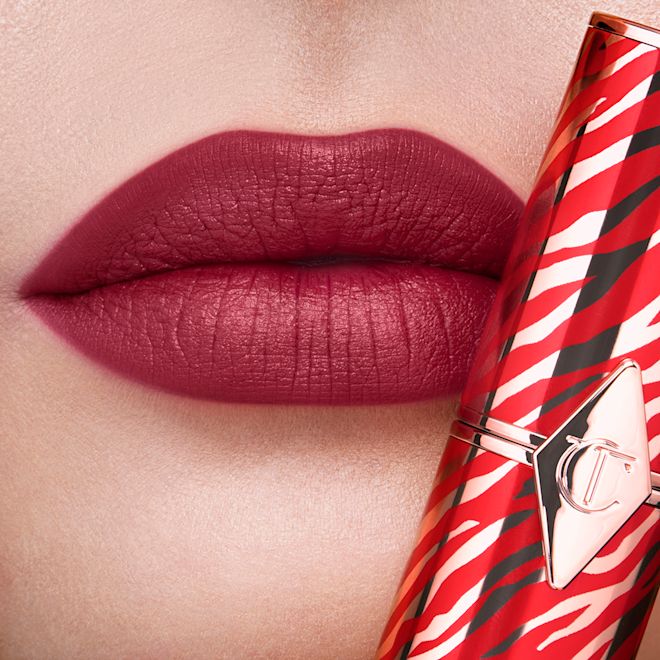 Hot Lips in K-Romance on fair-tone lips close-up Lips close-up of a fair-tone model wearing a matte lipstick in a soft, muted berry-rose colour.