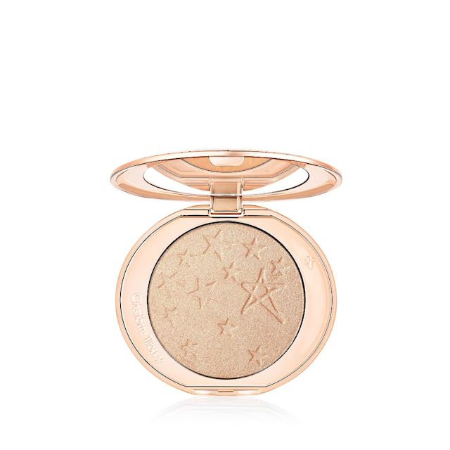 Charlotte's Hollywood Glow Glide Face Architect Highlighter in Champagne Glow, a warm, champagne pressed highlighter