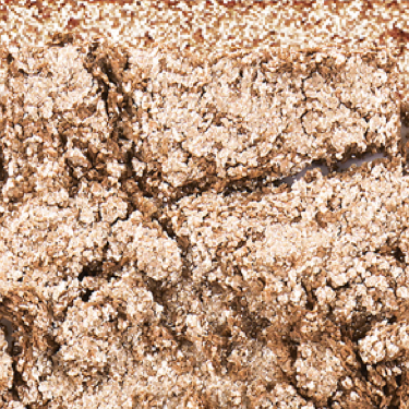 Swatch of an iridescent pearl eyeshadow with very fine shimmer. 